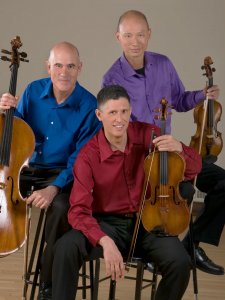 Members of Adaskin String Trio pose with their instruments
